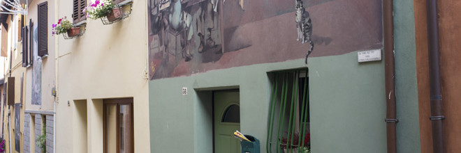 L’arte dei muri dipinti in Emilia Romagna scoperta in 5 passeggiate fotografiche e un concorso